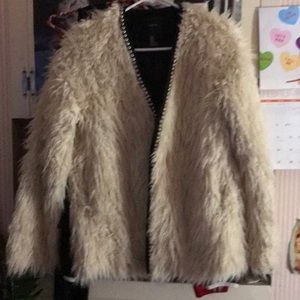 A white faux fur coat